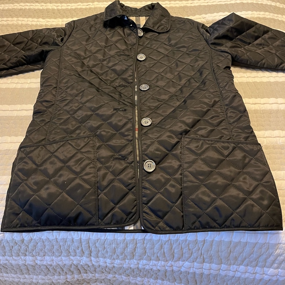 Burberry kids jacket fits like an XS Womens. In very good condition